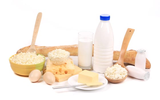 Dairy products and eggs with baguette. Isolated on a white background.