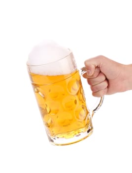 Male hand holding up a glass of beer. Isolated on a white background.