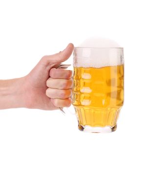 Male hand holding up a glass of beer. Isolated on a white background.