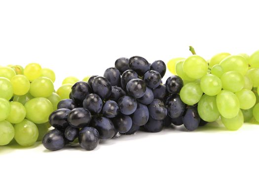 Bunch of ripe green and red grapes. Isolated on a white background.