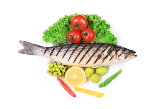 Grilled seabass with vegetables on plate. Isolated on a white background.