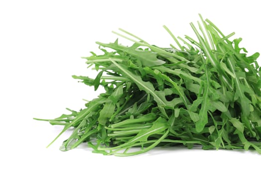 Ruccola leaves in closeup. Isolated on a white background.
