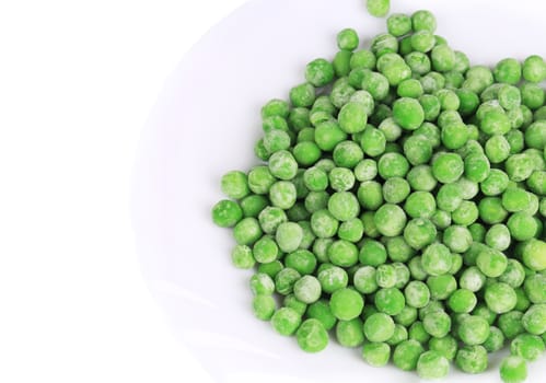 Frozen green peas. Isolated on a white background.