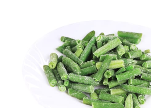 Frozen french beans.  Isolated on a white background.