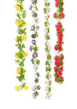 Various types of artificial flowers. Isolated on a white background.