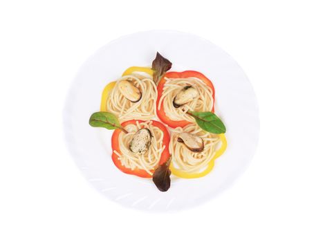 Pasta with mussels and basil. Isolated on a white background.
