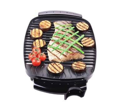 Grilled fish with vegetables. Isolated on a white background.
