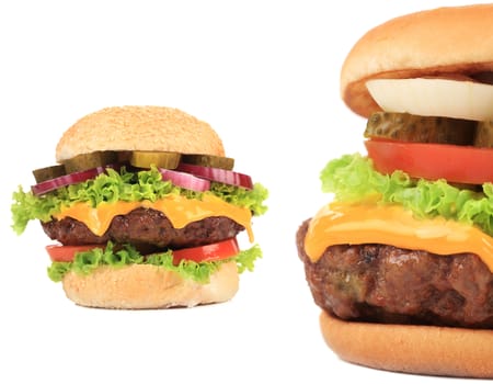 Two tasty cheeseburgers. Isolated on a white background.