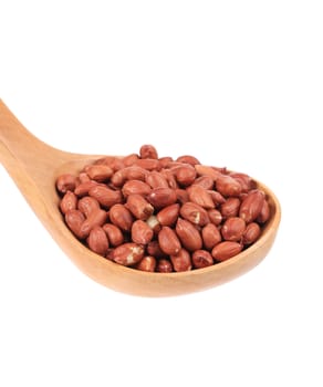 Wooden spoon with peanuts. Isolated on a white background.