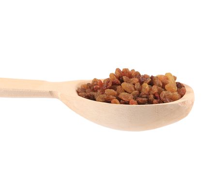 Wooden spoon with raisins. Isolated on a white background.