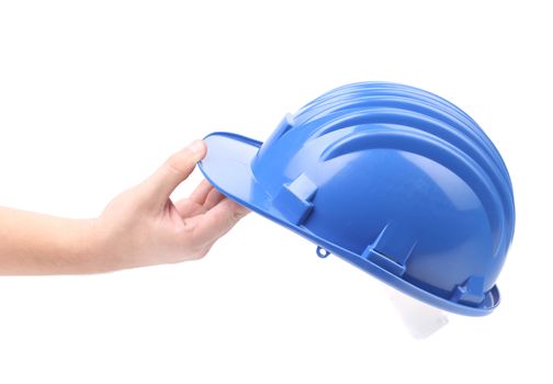 Hand holding blue hard hat. Isolated on a white background.
