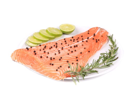 Salmon fillet with rosemary and lemon. Isolated on a white background.