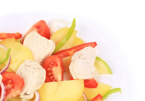 Chicken salad with potatoes. Isolated on a white background.