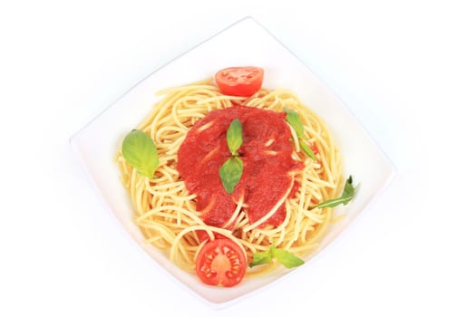 Pasta with tomato sauce and basil. Isolated on a white background.