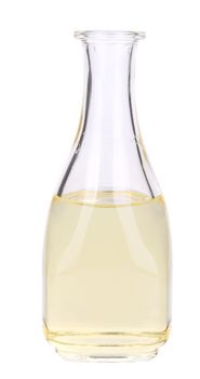 Small bottle of sunflower oil. Isolated on a white background.