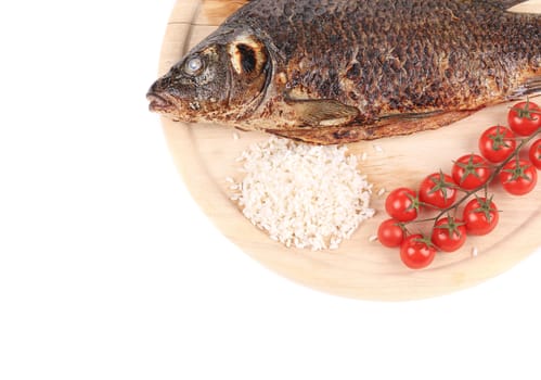 Grilled fish with rice and tomatoes. Isolated on a white background.