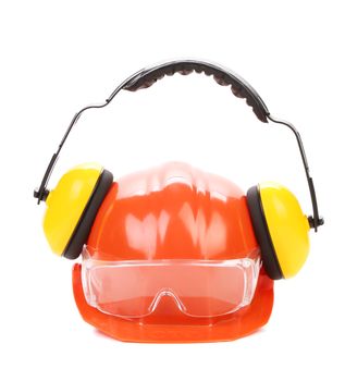 Orange safety helmet and protection headphones.  Isolated on a white background.