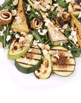Salad with grilled vegetables and tofu. Whole background.