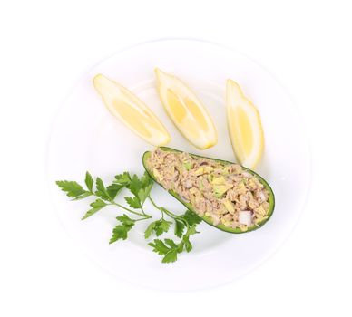 Avocado salad with tuna. Isolated on a white background.