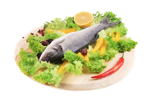Fresh seabass on platter with lettuce. Isolated on a white background.