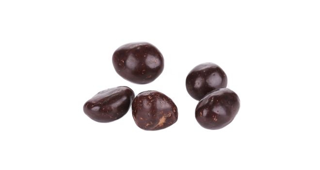 Dark brown dragee in chocolate cover. Isolated on a white background.