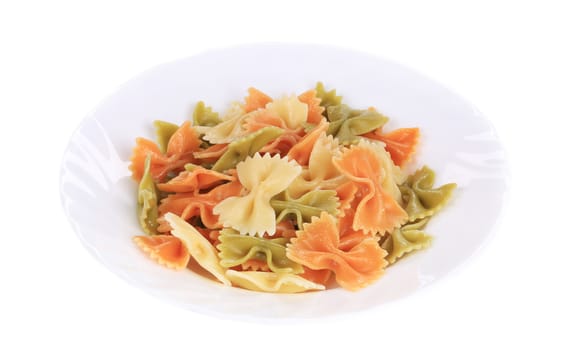 Colored farfalle on white plate. Isolated on a white background.