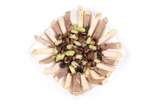 Delicious salad with beef tongue. Isolated on a white background.