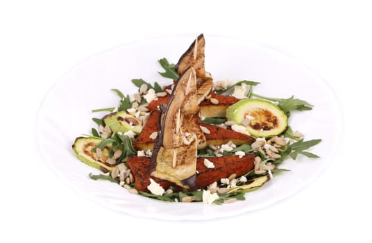 Salad with grilled vegetables and tofu. Isolated on a white background.
