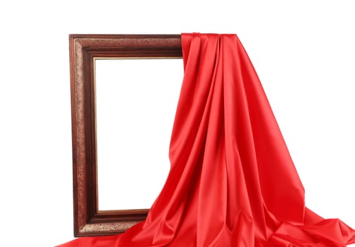 Old frame and red silk drapery. Isolated on a white background.