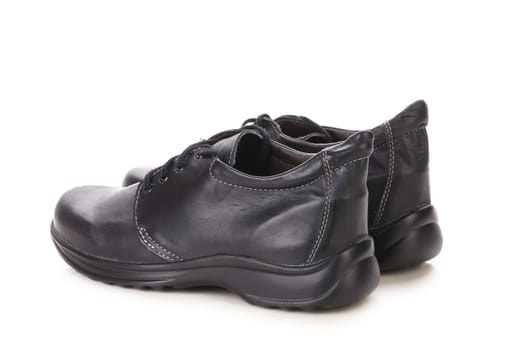 Pair of leather boots. Isolated on a white background.