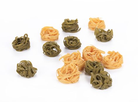 Raw italian pasta tagliatelle. Isolated on a white background.