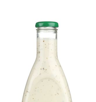 Glass bottle of white sauce. Isolated on a white background.