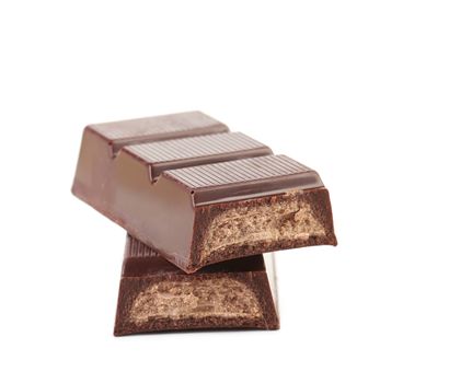 Dark chocolate bar with sweet creamy filling. Isolated on a white background.