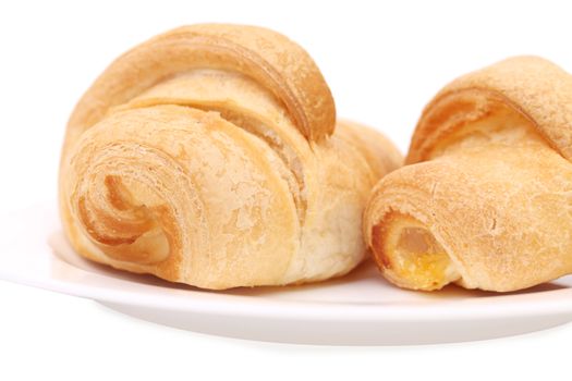 Croissants with vanilla cream. Isolated on a white background.