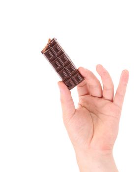 Hand holding tasty dark chocolate bar. Isolated on a white background.