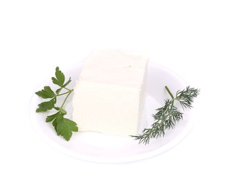 Sheep cheese on a white plate. Isolated on a white background.
