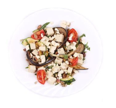 Salad with grilled vegetables and tofu. Isolated on a white background.