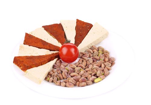 Tofu with pistachios. Isolated on a white background.