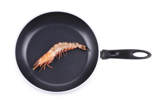 Raw shrimp on frying pan. Isolated on a white background.