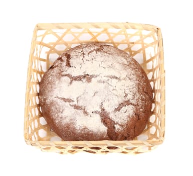 Tasty bread in wicker basket. Isolated on a white background.