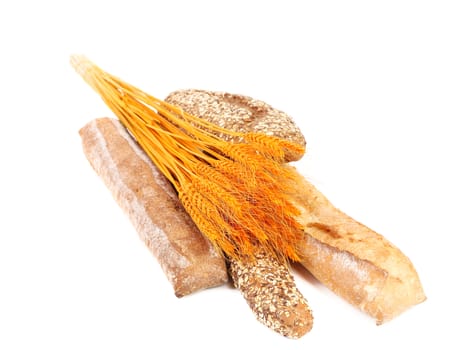 Fresh bread and wheat ears. Isolated on a white background.