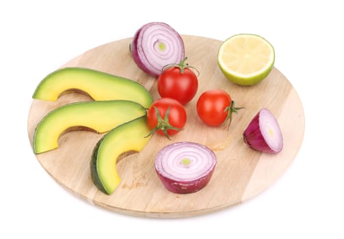 Fresh vegetables on platter. Isolated on a white background.