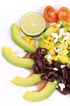 Red beans salad with avocado. Isolated on a white background.