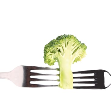 Photo of broccoli on a forks. Isolated on a white background.