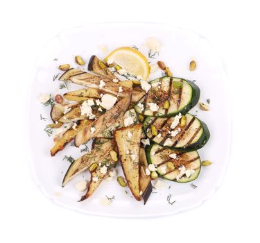 Salad with grilled vegetables and tofu. Isolated on a white background.