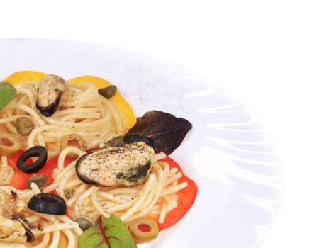 Seafood salad with spaghetti. Isolated on a white background.