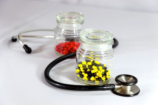 two bottles of medicine and stethoscope,shallow focus