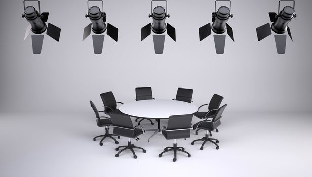 Round table and eight office chairs on a gray background. On the ceiling of the studio lighting lamps. Cooperation concept