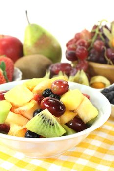 A white bowl with fresh fruit