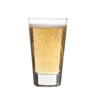 Glass of sparkling lemonade on white background